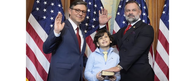 House Speaker Mike Johnson, R-La., left, poses during a ceremonial swearing-in with Rep. Cory Mills, R-Fla., in the Rayburn Room at the Capitol in Washington, Friday, Jan. 3, 2025. (AP Photo/Mark Schiefelbein)