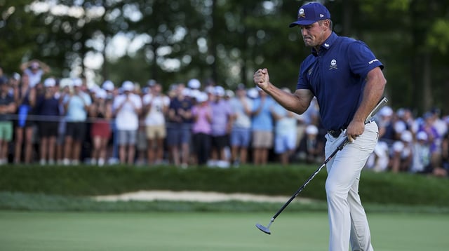 Aug 24, 2025; Detroit, Michigan, USA; Bryson DeChambeau of Crushers GC reacts to making his putt on the 18th green in a playoff hole during the finals of the LIV Golf Michigan Team Championship at The Cardinal at Saint John's Resort. Mandatory Credit: Aaron Doster-Imagn Images