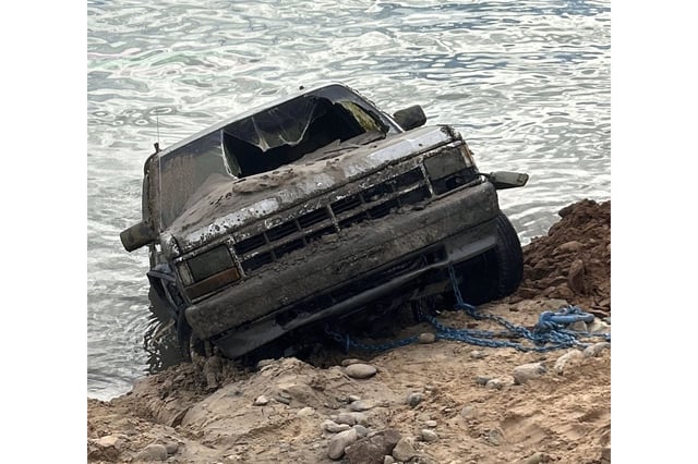 A truck belonging to a man who has been missing since December 2023 being recovered from Lake Powell in Utah, Wednesday, Sept. 3, 2025.
