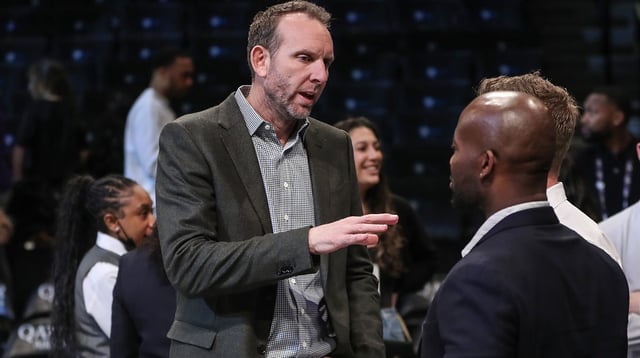 Feb 29, 2024; Brooklyn, New York, USA; Brooklyn Nets General Manager Sean Marks speaks to a group of people prior to the game against the Atlanta Hawks at Barclays Center. Mandatory Credit: Wendell Cruz-Imagn Images