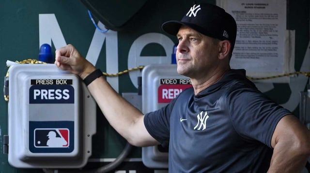 Aug 15, 2025; St. Louis, Missouri, USA; New York Yankees manager Aaron Boone (17) looks on from the dugout before a game against the St. Louis Cardinals at Busch Stadium. Mandatory Credit: Jeff Curry-Imagn Images