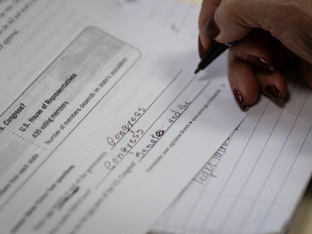 An immigrant studies to take a U.S. citizenship exam on March 29, 2025 at an undisclosed location, Connecticut. She was attending a citizenship study group held at a non-profit community center. Many immigrants, including legal green card holders, have expressed extreme anxiety as the Trump administration enacts more stringent immigration policies, including mass deportations of undocumented people living in the United States. (Photo by John Moore/Getty Images)