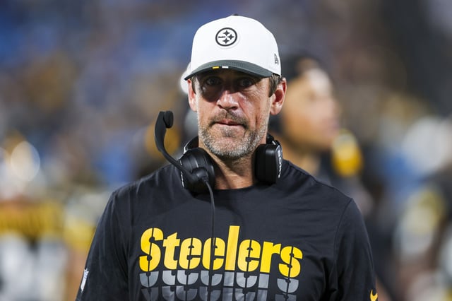 Aaron Rodgers #8 of the Pittsburgh Steelers looks on from the sidelines during a NFL Preseason 2025 game against the Carolina Panthers at Bank of America Stadium on August 21, 2025 in Charlotte, North Carolina.