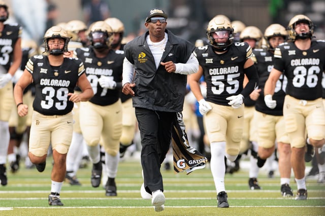 Head coach Deion Sanders of the Colorado Buffaloes runs out prior to the game against the Georgia Tech Yellow Jackets at Folsom Field on August 29, 2025 in Boulder, Colorado.