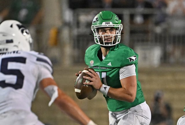 Quarterback Jerry Kaminski #11 of the North Dakota Fighting Hawks looks downfield against the Kansas State Wildcats in the second half at Bill Snyder Family Football Stadium on August 30, 2025, in Manhattan, Kansas.