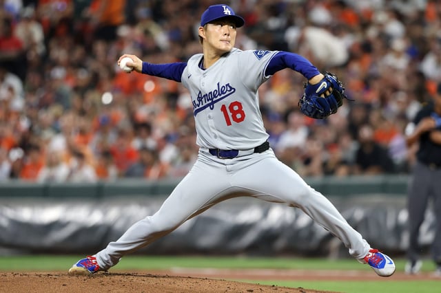 Los Angeles Dodgers pitcher Yoshinobu Yamamoto (18) throws during the first inning against the Baltimore Orioles at Oriole Park at Camden Yards on Sep 6, 2025.
