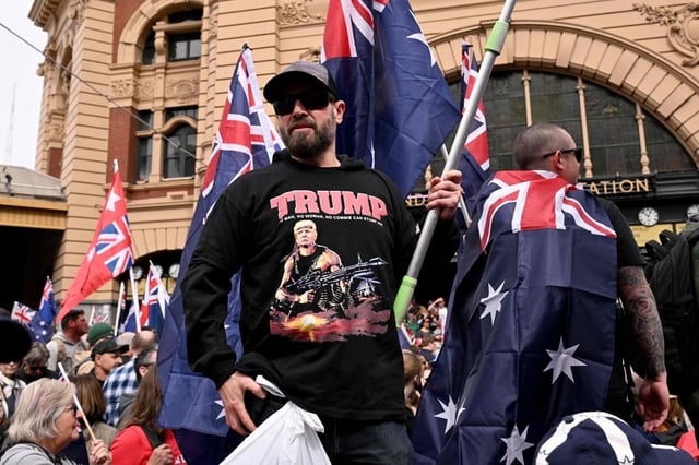 A protester wearing a shirt showing an image of US President Donald Trump as a stylised depiction of Rambo during the “March for Australia” anti-immigration rally in Melbourne on August 31. Photo: AFP