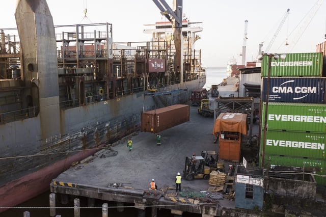 A container is loaded onto a cargo ship a day ahead of general elections in Georgetown, Guyana, Sunday, Aug. 31, 2025. (AP Photo/Matias Delacroix)