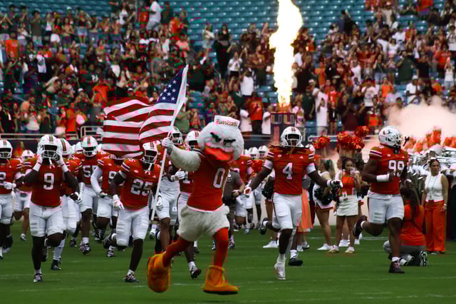 Miami Hurricanes players run out of the field before their game against Bethune-Cookman on Saturday, Sept. 6 at Hard Rock Stadium. Photo credit: Melissa Borges