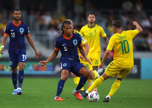 Soccer Football - World Cup - UEFA Qualifiers - Group G - Lithuania v Netherlands - Darius and Girenas Stadium, Kaunas, Lithuania - September 7, 2025 Netherlands' Nathan Ake in action with Lithuania's Gratas Sirgedas REUTERS/Kacper Pempel