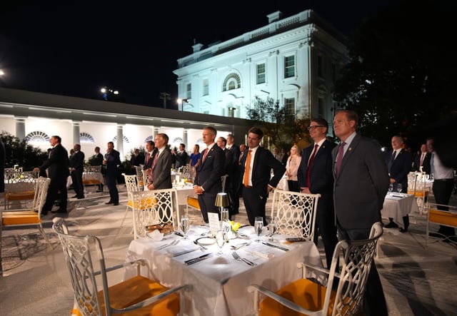 Members of Congress stand as they listen to President Donald Trump deliver remarks during a dinner in the Rose Garden at the White House on September 05, 2025 in Washington, DC.