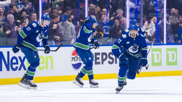 Feb 2, 2025; Vancouver, British Columbia, CAN; Vancouver Canucks forward Filip Chytil (72) and defenseman Marcus Pettersson (29) and defenseman Tyler Myers (57) and forward Dakota Joshua (81) celebrate Chytil’s goal against the Detroit Red Wings in the third period at Rogers Arena. Mandatory Credit: Bob Frid-Imagn Images