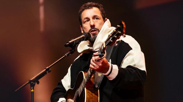 Adam Sandler performs onstage in this photo provided in promotion of his 2025 You're My Best Friend comedy tour.
