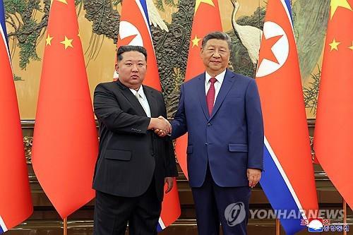 This photo, published by North Korea's Korean Central News Agency on Sept. 5, 2025, shows leader Kim Jong-un (L) holding hands with Chinese President Xi Jinping during their talks the previous day. (For Use Only in the Republic of Korea. No Redistribution) (Yonhap)