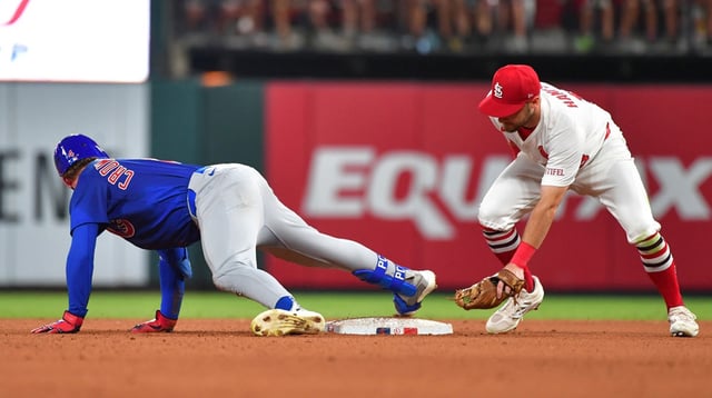 Jun 25, 2025; St. Louis, Missouri, USA; Chicago Cubs outfielder Pete Crow-Armstrong (4) is safe at second base as St. Louis Cardinals second baseman Garrett Hampson (13) was late putting the tag on him at Busch Stadium. Mandatory Credit: Tim Vizer-Imagn Images.