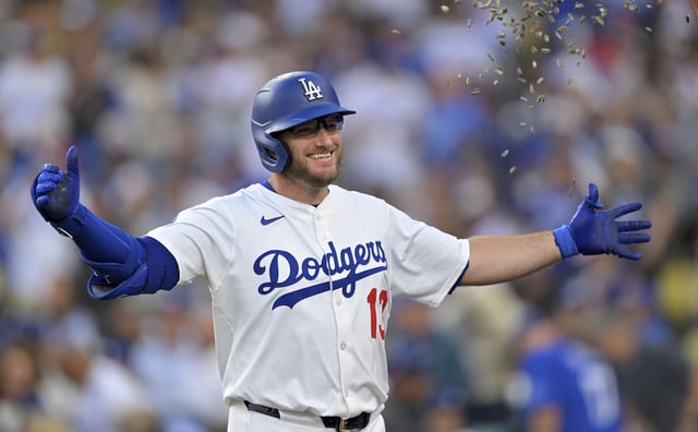 The Dodgers’ Max Muncy gets showered with sunflower seeds as he returns to the dugout after hitting a solo home run during a game against the St. Louis Cardinals last month at Dodger Stadium. The Dodgers welcomed Muncy back from the injured list on Monday and immediately inserted him in the cleanup spot. (AP Photo/Jayne Kamin-Oncea)