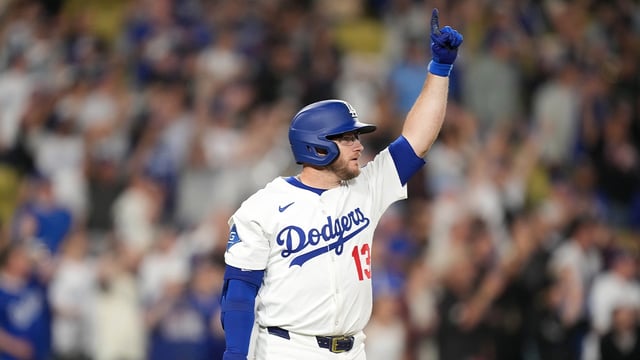 Los Angeles Dodgers third baseman Max Muncy (13) celebrates after hitting a sacrifice fly in the 10th inning against the Arizona Diamondbacks at Dodger Stadium. Mandatory Credit: Kirby Lee-Imagn Images