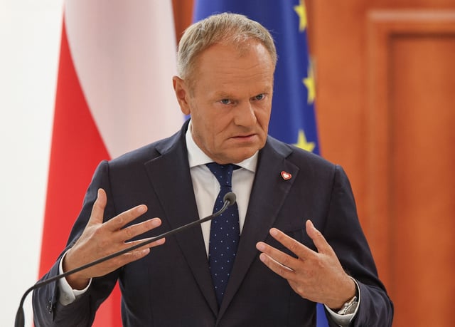 Poland's Prime Minister Donald Tusk speaks during a joint statement with Germany's Chancellor Friedrich Merz, Moldovan President Maia Sandu, and France's President Emmanuel Macron after a meeting at the Presidential Palace in Chisinau, Moldova, August 27, 2025.  REUTERS/Vladislav Culiomza/File Photo