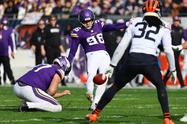 Nov 24, 2024; Chicago, Illinois, USA; Minnesota Vikings place kicker John Parker Romo (96) kicks a PAT against the Chicago Bears during the second quarter at Soldier Field. Mandatory Credit: Mike Dinovo-Imagn Images/ File Photo