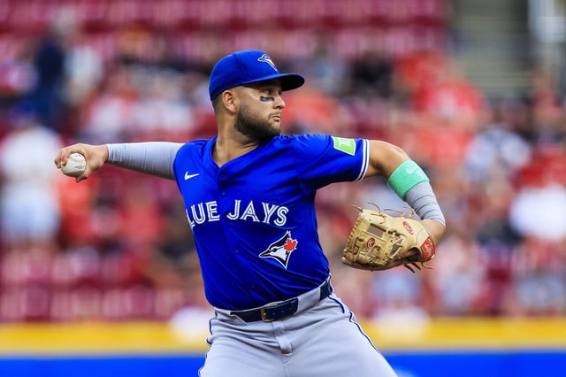 Sep 2, 2025; Cincinnati, Ohio, USA; Toronto Blue Jays shortstop Bo Bichette (11) throws to first to get Cincinnati Reds third baseman Ke'Bryan Hayes (not pictured) out in the second inning at Great American Ball Park. Mandatory Credit: Katie Stratman-Imagn Images
