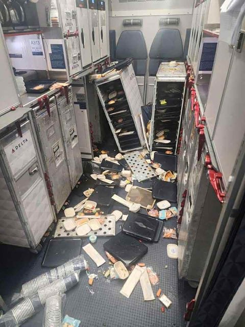 Plane service carts, food items thrown about after turbulence onboard Delta Flight 56.