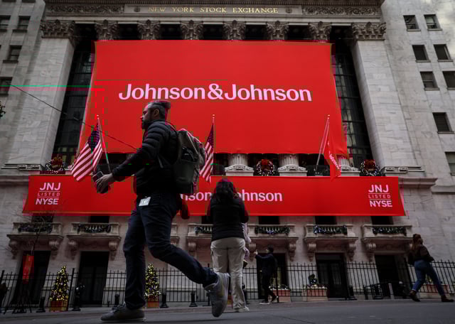 A Johnson & Johnson banner is displayed on the front of the New York Stock Exchange (NYSE) in New York City, in New York City, U.S., December 5, 2023. REUTERS/Brendan McDermid/File Photo