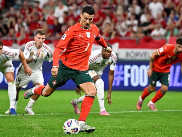 Portugal's Cristiano Ronaldo scores his side's second goal from the penalty spot during a World Cup 2026 group F qualifying soccer match between Hungary and Portugal at the Puskas Arena in Budapest, Tuesday, Sept. 9, 2025. (AP Photo/Denes Erdos)