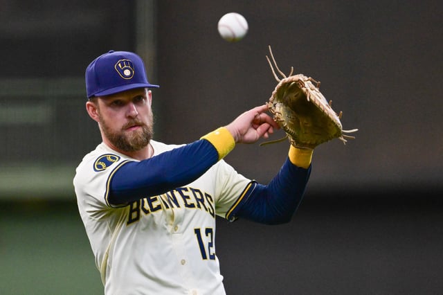Jun 9, 2025; Milwaukee, Wisconsin, USA;  Milwaukee Brewers first baseman Rhys Hoskins (12) warms up before game against the Atlanta Braves at American Family Field. Mandatory Credit: Benny Sieu-Imagn Images/File Photo
