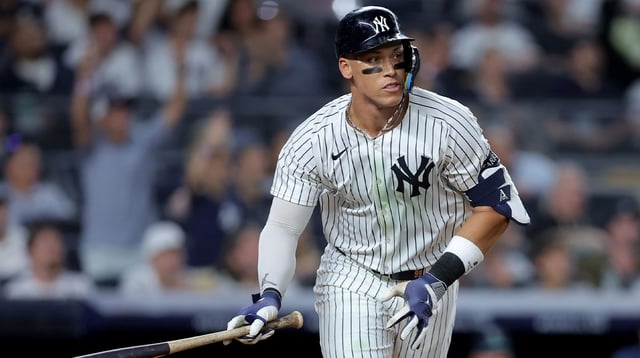 Jul 8, 2025; Bronx, New York, USA; New York Yankees right fielder Aaron Judge (99) watches his solo home run against the Seattle Mariners during the seventh inning at Yankee Stadium. Mandatory Credit: Brad Penner-Imagn Images