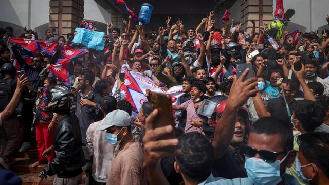Demonstrators celebrate at the Parliament complex during a protest against Monday's killing of 19 people after anti-corruption protests that were triggered by a social media ban, which was later lifted, during a curfew in Kathmandu, Nepal, September 9, 2025. REUTERS/Adnan Abidi