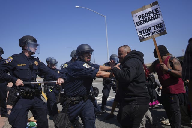 California Highway Patrol officers clash with protesters on Tuesday, June 10, 2025, in Los Angeles.