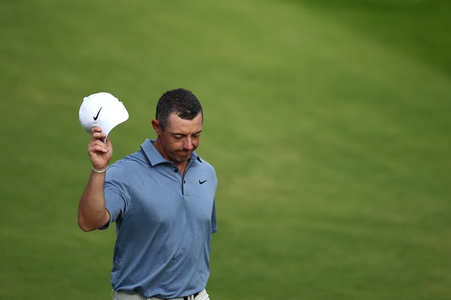 Northern Ireland's Rory McIlroy waves to fans as he walks up the 18th fairway on day four of the 153rd Open Championship at Royal Portrush golf club in Northern Ireland on July 20, 2025.