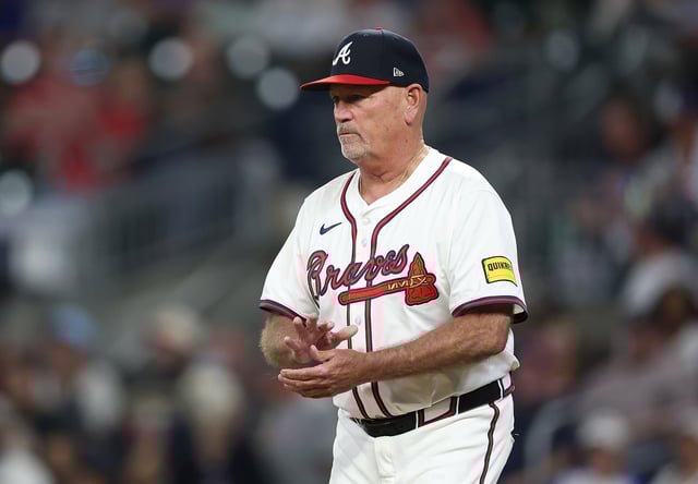 ATLANTA, GEORGIA - SEPTEMBER 08: Manager Brian Snitker #43 of the Atlanta Braves walks out to relieve Bryce Elder #55 in the seventh inning against the Chicago Cubs at Truist Park on September 08, 2025 in Atlanta, Georgia.
