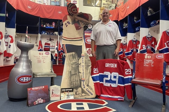 Western Canada Montreal Canadiens Fan Club president and founder James Taman standing behind a tribute created for six-time Stanley Cup champion Ken Dryden, who died on September 5, 2025