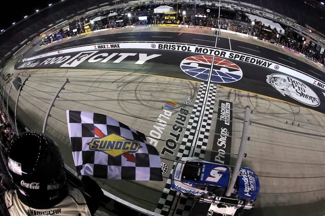 Kyle Larson, driver of the #5 HendrickCars.com Chevrolet, takes the checkered flag to win the NASCAR Cup Series Bass Pro Shops Night Race at Bristol Motor Speedway on September 21, 2024 in Bristol, Tennessee. (Photo by Jonathan Bachman/Getty Images)