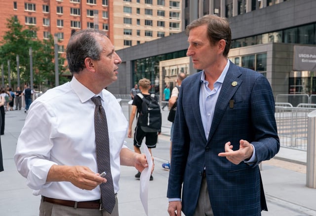 Congressman Dan Goldman, right, talks with New York City Comptroller Brad Lander before speaking at a press conference outside the Jacob K. Javits Federal Building on Tuesday, July 8, 2025 in Manhattan, New York. (Barry Williams/ New York Daily News)