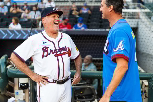 ATLANTA, GA - SEPTEMBER 9: Brian Snitker #43 of the Atlanta Braves and Brian Finneran talk before the game against the Chicago Cubs at Truist Park on September 9, 2025 in Atlanta, Georgia.