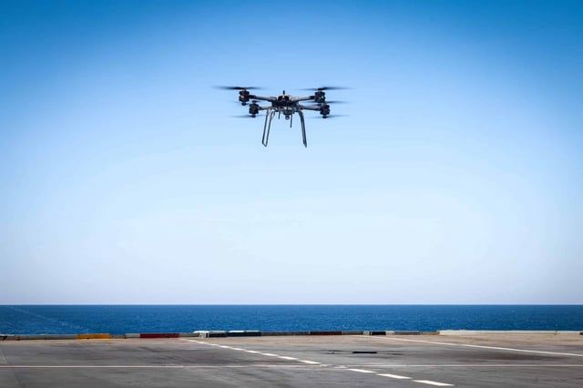 A UAV is launched onboard the UK aircraft carrier HMS Prince of Wales during the CSG25 deployment. The RN is planning to accelerate getting uncrewed systems to sea over the next two years.