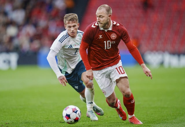 Denmark midfielder Christian Eriksen (R) suffered a cardiac arrest during a game against Finland at the Euros in 2021
