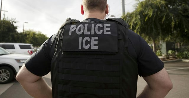 FILE - In this July 8, 2019, file photo, a U.S. Immigration and Customs Enforcement (ICE) officer looks on during an operation in Escondido, Calif. International students will be forced to leave the U.S. or transfer to another college if their schools offer classes entirely online this fall, under new guidelines issued Monday by federal immigration authorities. The guidelines, issued by U.S. Immigration and Customs Enforcement, provide additional pressure for campuses to reopen even amid growing