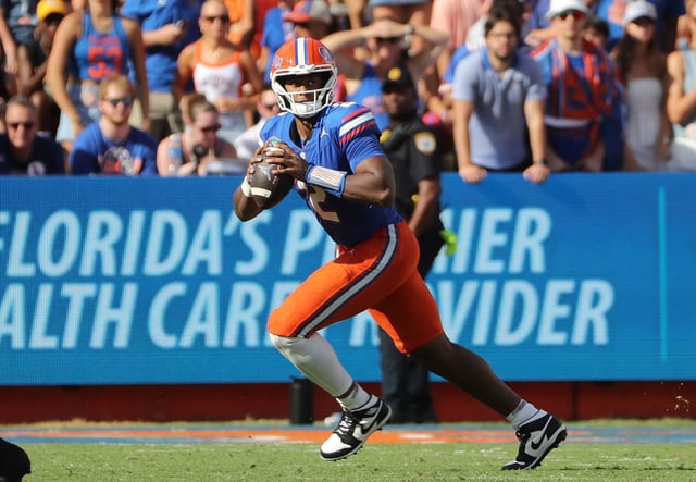 Gators quarterback DJ Lagway scrambles against USF at Ben Hill Griffin Stadium in Gainesville on Saturday, Sept. 6, 2025. (Stephen M. Dowell/Orlando Sentinel)