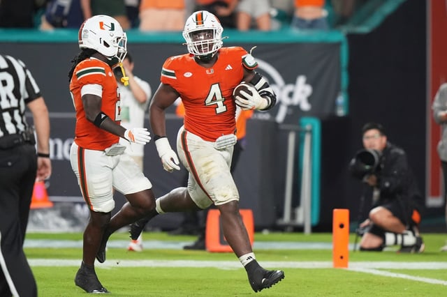 Miami defensive lineman Rueben Bain Jr. (4) reacts after intercepting a pass thrown by Notre Dame quarterback CJ Carr during the second half of an NCAA college football game, Sunday, Aug. 31, 2025, in Miami Gardens, Fla. (AP Photo/Lynne Sladky)
