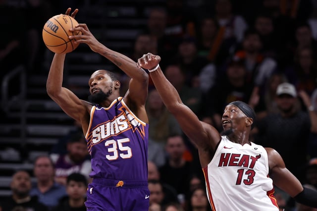 Kevin Durant #35 of the Phoenix Suns controls a rebound over Bam Adebayo #13 of the Miami Heat during the second half at Footprint Center on November 06, 2024 in Phoenix, Arizona.