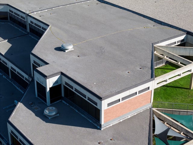 A drone view shows the reported location of the shooter on a rooftop, at the scene where U.S. right-wing activist, commentator, Charlie Kirk, an ally of U.S. President Donald Trump, was fatally shot during an event at Utah Valley University, in Orem, Utah, U.S. September 11, 2025.  REUTERS/Cheney Orr