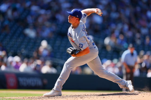 DENVER, CO - AUGUST 21: Matt Sauer #64 of the Los Angeles Dodgers delivers a pitch in the seventh inning against the Colorado Rockies at Coors Field on August 21, 2025 in Denver, Colorado.