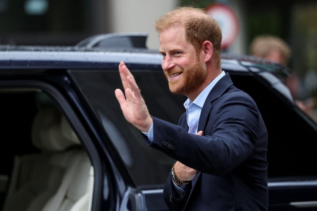 Prince Harry gestures as he departs after visiting the Centre for Blast Injury Studies at Imperial College London on September 10, 2025.