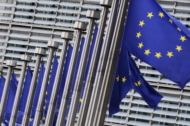 European Union flags flap in the wind outside EU headquarters in Brussels, Wednesday, Sept. 3, 2025. (AP Photo/Virginia Mayo)