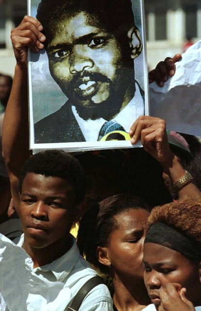 Crowds pay tribute to anti-Apartheid hero Steve Biko as President Nelson Mandela unveils a statue of him outside the East London city hall, September 12/File Photo