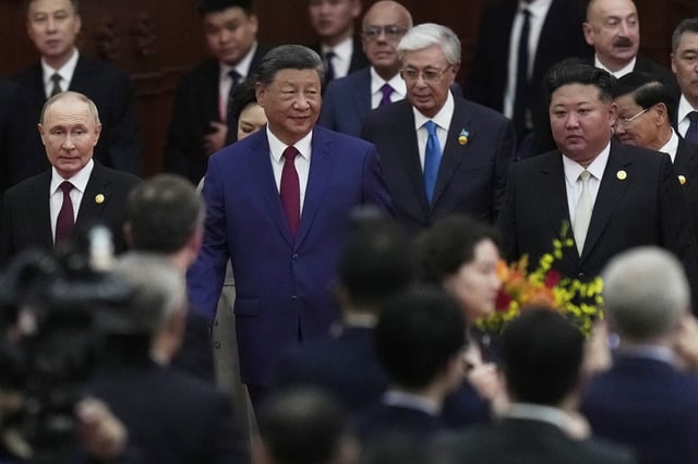 Chinese leader Xi Jinping walks with North Korean’s Kim Jong Un and Russia’s Vladimir Putin following a military parade in Beijing, Sept. 3, 2025 (AP photo by Mahesh Kumar).