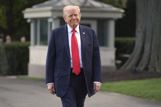 President Donald Trump walks to speaks with reporters before boarding Marine One on the South Lawn of the White House, Thursday, Sept. 11, 2025, in Washington.